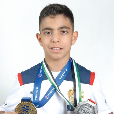 Mark Ghambaryan proudly displaying his IMMAF European Championship gold medal and World Championship silver medal.