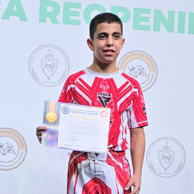 Mark Ghambaryan on first place podium at the Armenian Pankration Championship after winning the title.