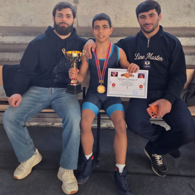 Mark Ghambaryan posing with European Freestyle Wrestling Champions Vazgen Tevanyan and Arman Andreasyan.