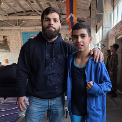 Mark Ghambaryan standing with European Wrestling Champion Vazgen Tevanyan.